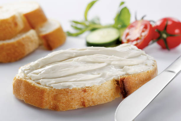 istock slice of bread with cream cheese (selective focus) 1137169378