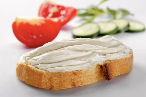 istock slice of bread with cream cheese (selective focus) 1137169408