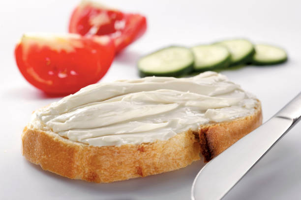 istock slice of bread with cream cheese (selective focus) 1137169424