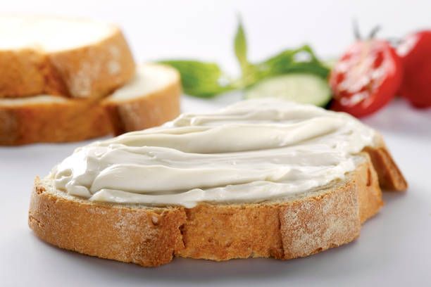 istock slice of bread with cream cheese (selective focus) 1137169560
