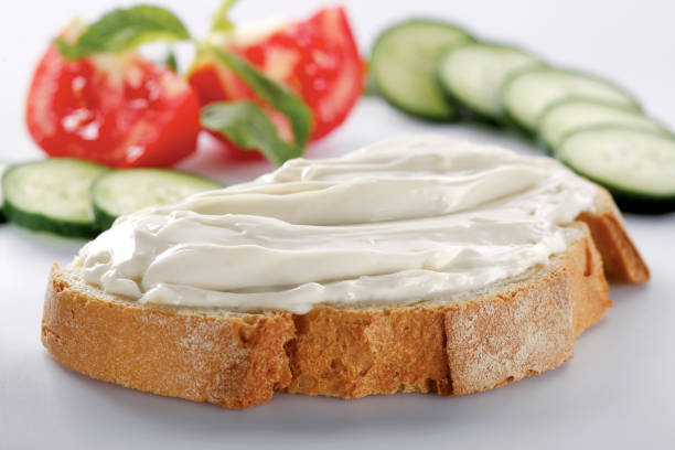 istock slice of bread with cream cheese (selective focus) 1137169610