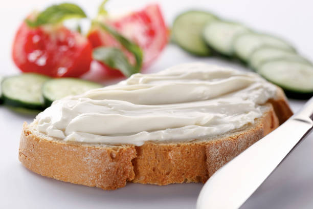 istock slice of bread with cream cheese (selective focus) 1137169678