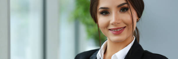 istock Beautiful smiling clerk girl wearing suit hold notebook 1137174911