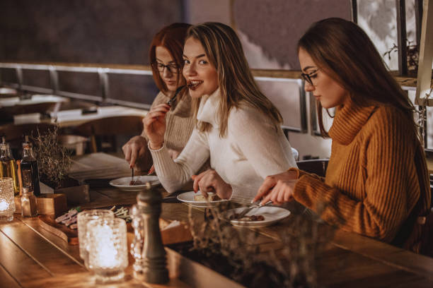 istock Women eating in a restaurant 1137175074