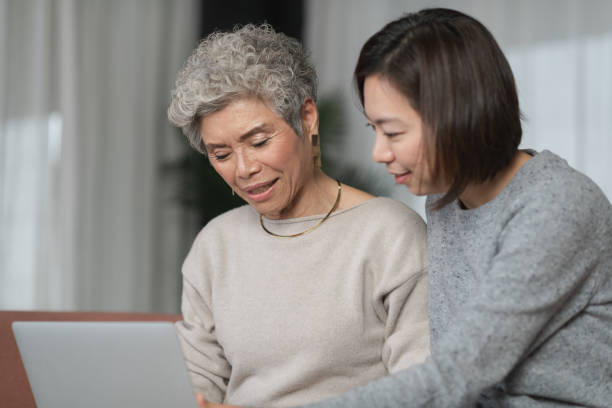 istock Adult Daughter Teaching Her Mother How to Use A Computer 1137175235