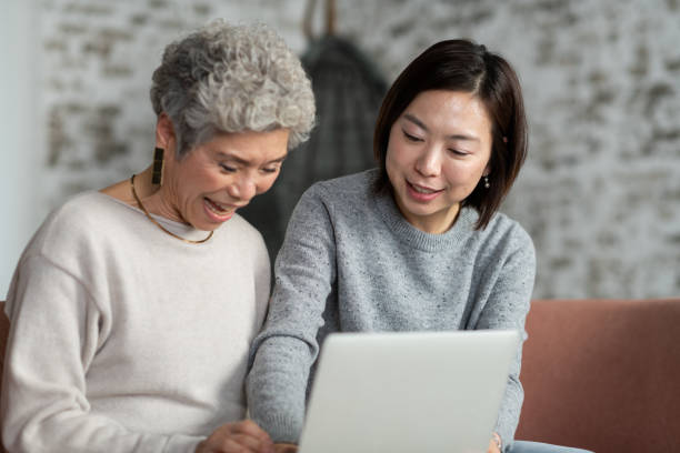istock Adult Daughter Teaching Her Mother How to Use A Computer 1137175239