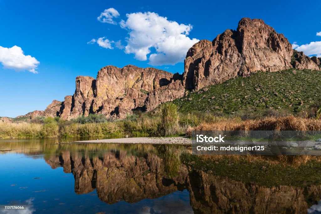 The Salt River near Mesa, Arizona. Scenic view of the Salt River with desert mountains reflecting in the water near Mesa, Arizona. Arizona Stock Photo
