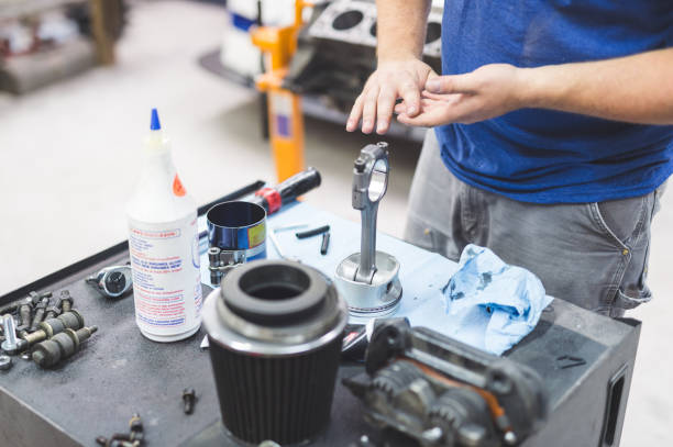 istock Mechanic works on car in his home garage 1137177106