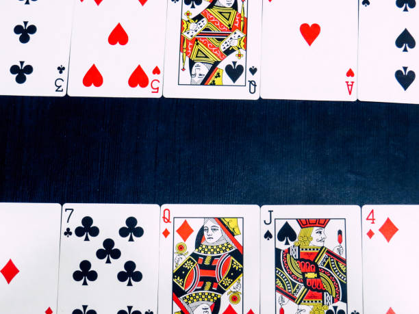 istock Various pokers cards in black background 1137188990