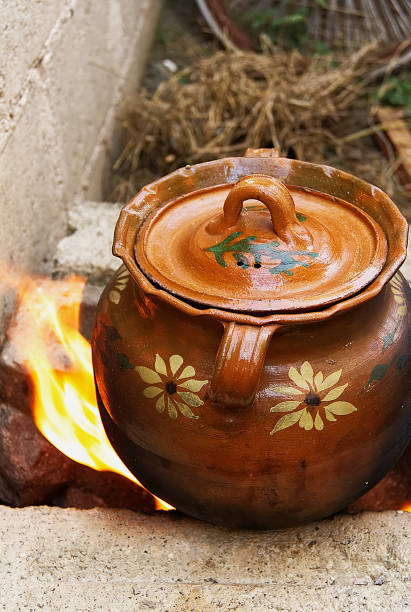 istock clay pot covered in brown, on gray brick fire, close-up 1137196467