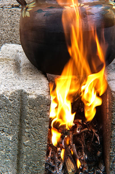 istock clay pot covered in brown, on gray brick fire, close-up 1137202046