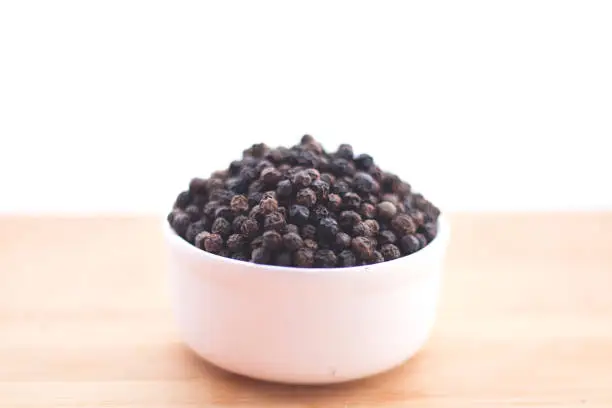 Black pepper kept in a Bowl with background-Image