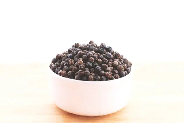 Black pepper kept in a Bowl with background-Image