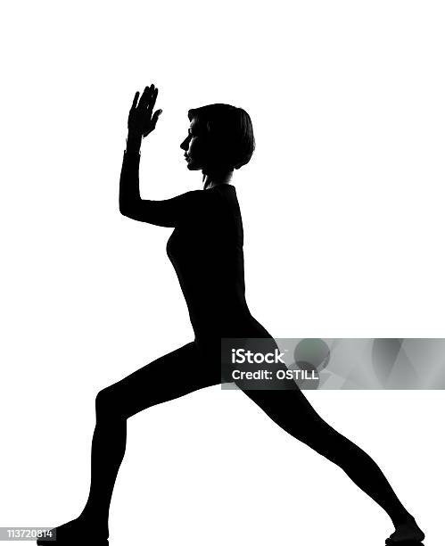 Woman Virabhadrasana 2 Warrior Exercising Fitness Yoga Stretching Stock Photo - Download Image Now