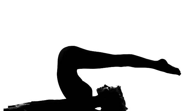istock woman halasana Shoulder Stand yoga pose 113720816