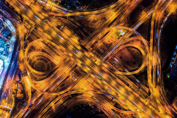 istock Aerial view of traffic on massive highway intersection at night. 1137208748