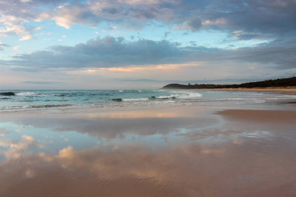 istock beautiful sky reflected in water on beach 1137209050