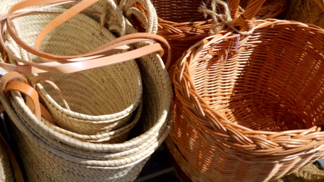 A row from many of wicker baskets for sale in Spain