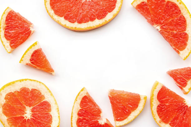 istock Creative summer pattern made of grapefruit slices on white background. Fruit minimal concept 1137218057