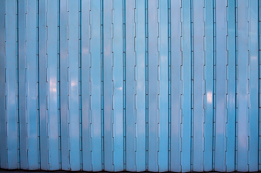Closed grey mix blue steel door stretch with shutter door