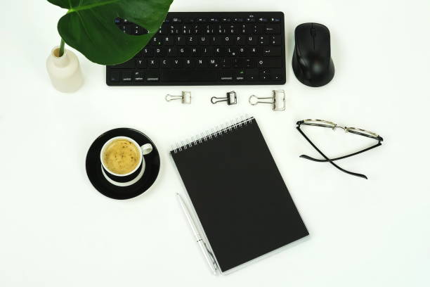istock Flat lay, top view office desk.  workspace with laptop,  notebook,  accessories, cup of coffee, green plant on white background. Copy space. 1137229616