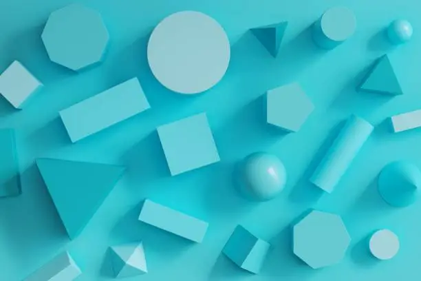 Photo of blue monotone geometric shapes set on blue background. minimal flat lay concept