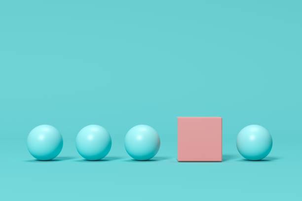 istock outstanding pink box among blue spheres on blue background. minimal concept idea 1137232475