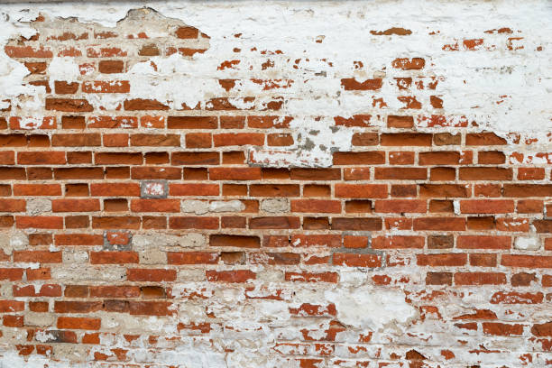 istock The texture of the old brick wall painted white with peeling paint 1137233716