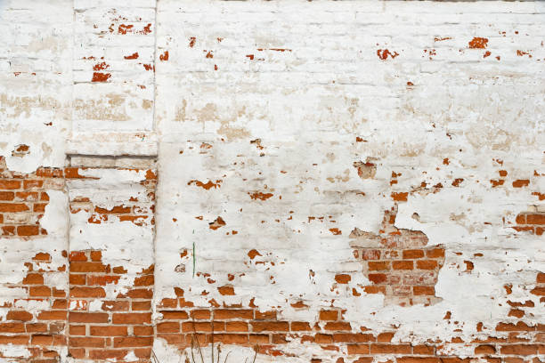 istock The texture of the old brick wall painted white with peeling paint 1137233720