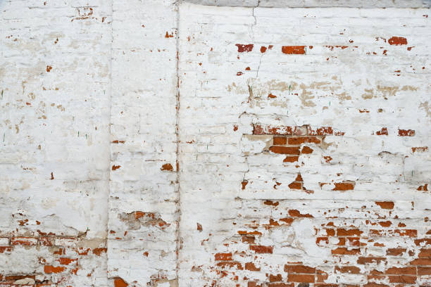 istock The texture of the old brick wall painted white with peeling paint 1137233727