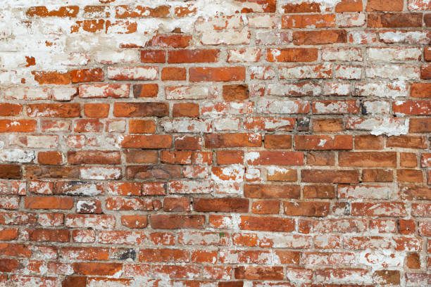 istock The texture of the old brick wall painted white with peeling paint 1137233740