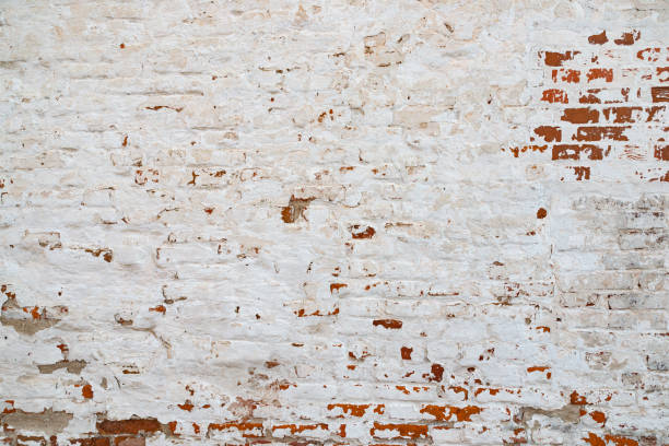 istock The texture of the old brick wall painted white with peeling paint 1137233749