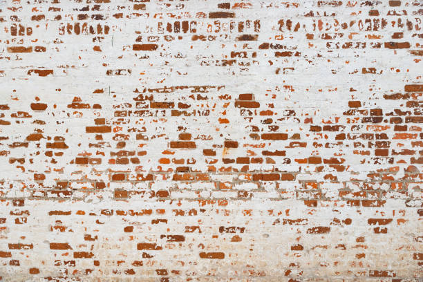 istock The texture of the old brick wall painted white with peeling paint 1137233754