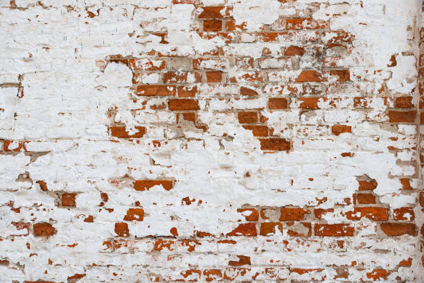 istock The texture of the old brick wall painted white with peeling paint 1137233756