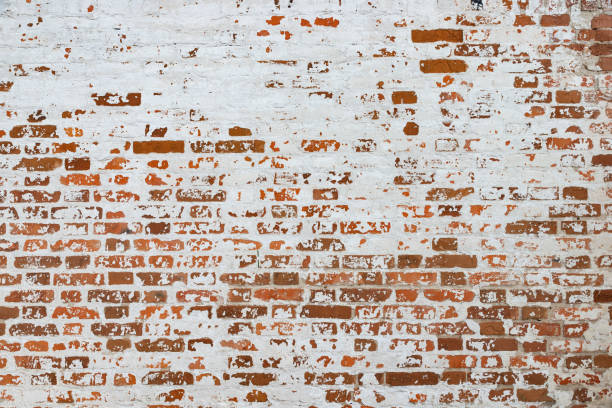 istock The texture of the old brick wall painted white with peeling paint 1137233761