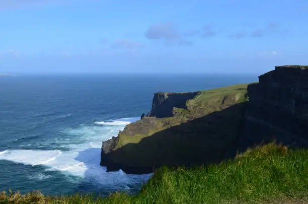 Ireland's Galway Bay churning below the scenic Cliffs of Moher in Ireland.