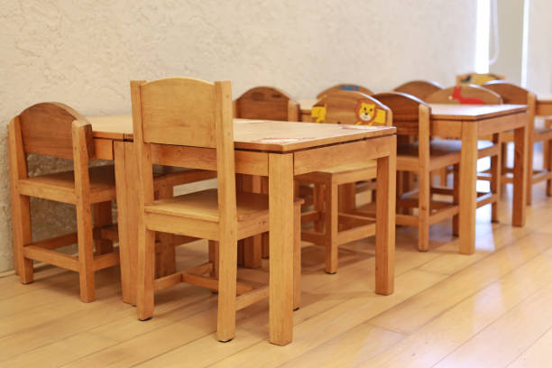 istock Small desk and chairs for kid in student classroom. 1137238520