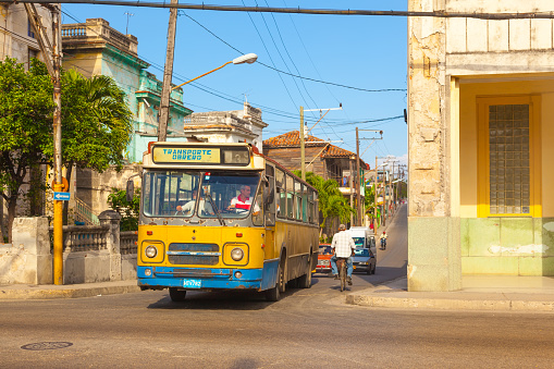 Authentic old street  in the city of Havana in the old district inner-city of Serrra. Public municipall bus. City HAVANA,CUBA.