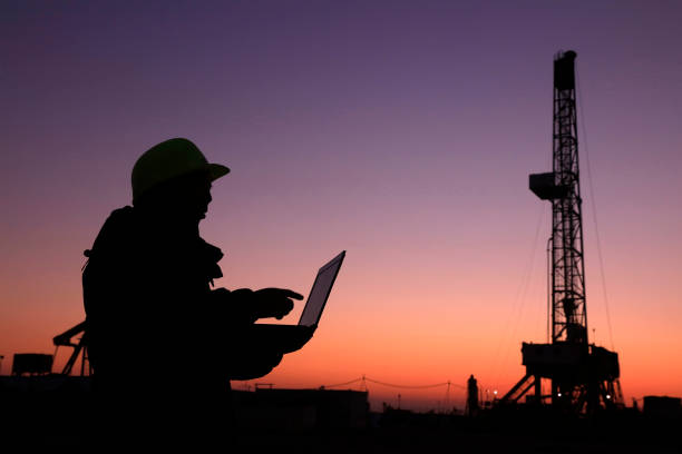 istock Oil drilling frame and exploration technician in a oilfield 1137247938
