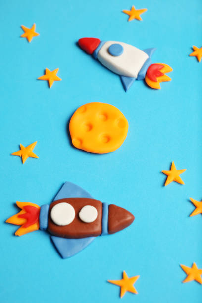 istock Two rocket in space, star, and moon. Plasticine art, cartoon 1137248352