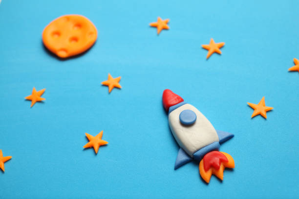 istock Rocket in space, star, and moon. Plasticine art, cartoon 1137248386