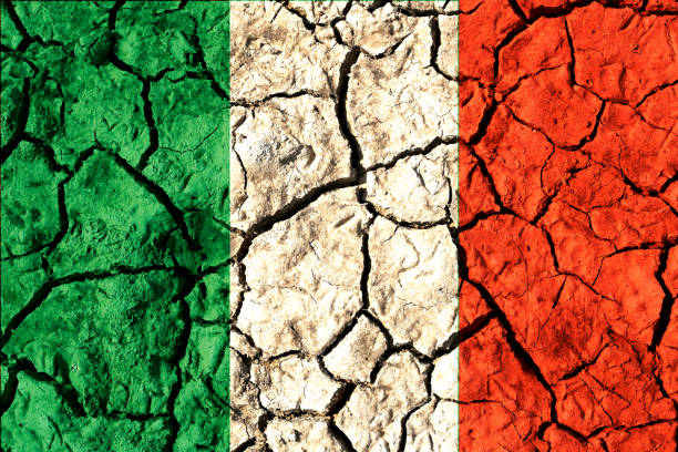 Flag of Italy on cracked land stock photo