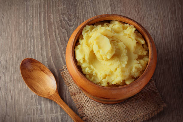 istock mashed potatoes puree in wooden bowl on table with spices 1137251703