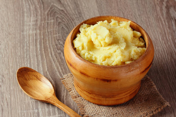 istock mashed potatoes puree in wooden bowl on table with spices 1137253356