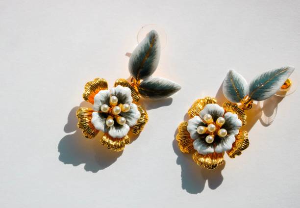 istock Beautiful gold earrings on a white background. 1137253693