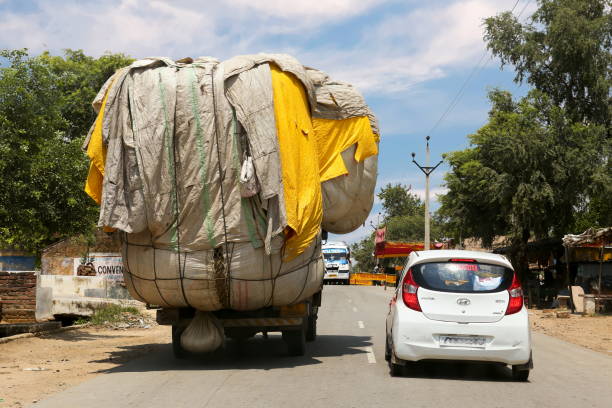 truck with overload goods on road in Leh town,India.
