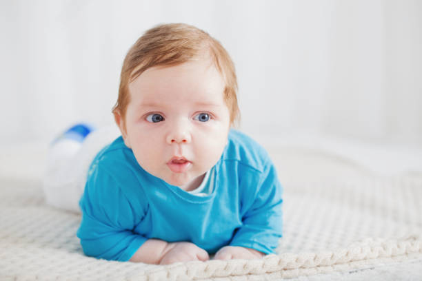 istock baby 2 months on bed 1137262310