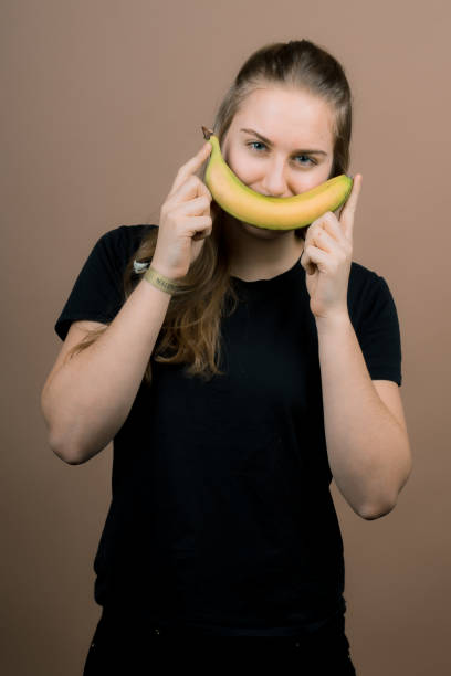 istock girl with a banana 1137264405