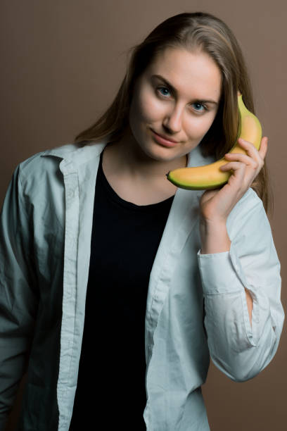 istock girl with a banana 1137264419