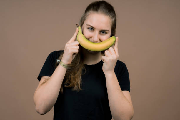 istock girl with a banana 1137264543